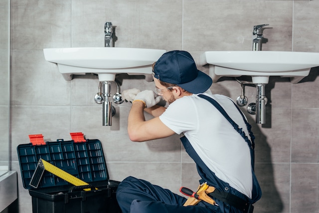 A plumber fixing an issue