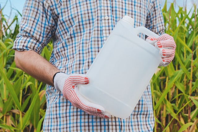 Man holding pesticide