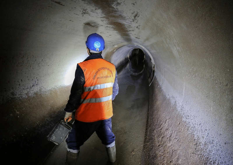 A plumber inspecting a sewer