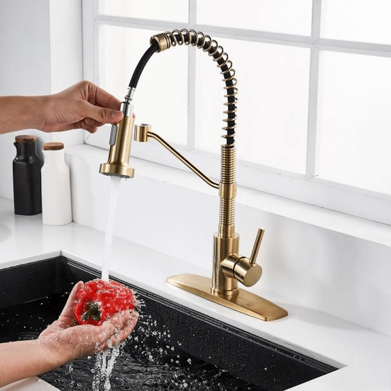 A brass kitchen faucet 