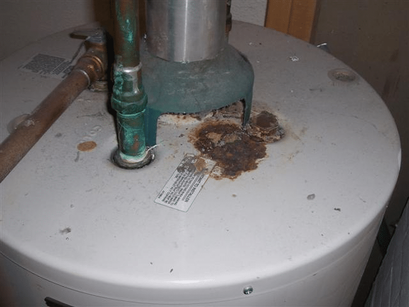 A water heater with some rust 