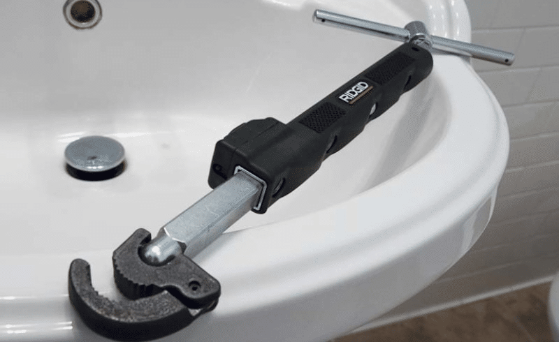 A basin wrench on a sink 