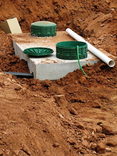 A septic tank in the ground. 