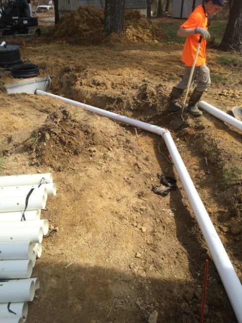 A plumber fixing a septic tank 