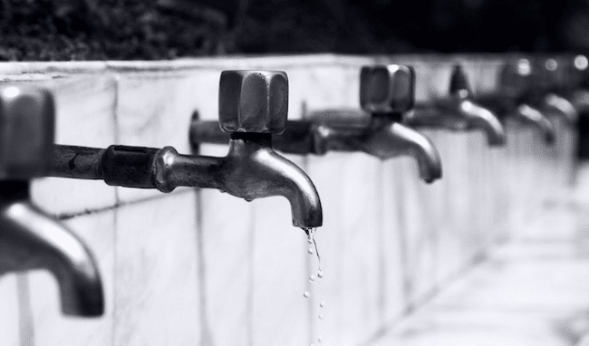 A line of dripping faucets