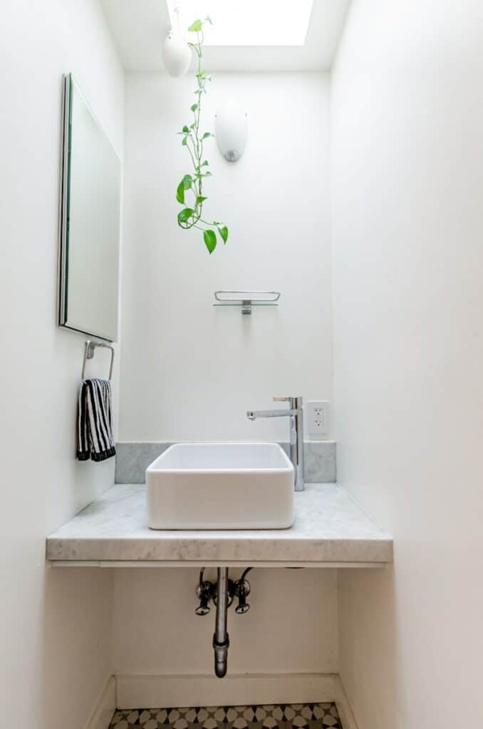 white ceramic sink with faucet