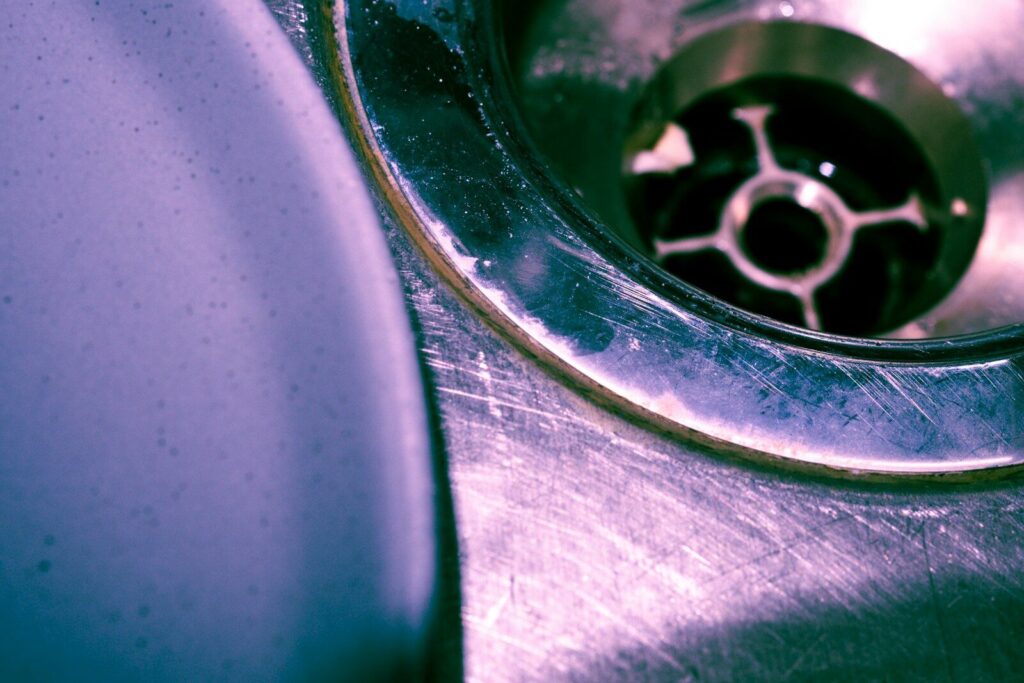 Close up of a stainless steel sink drain
