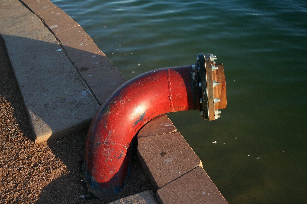 Photo by Jace pipe, nature, red, lake, drain pipe, water, drain, pump, tube, pipeline
