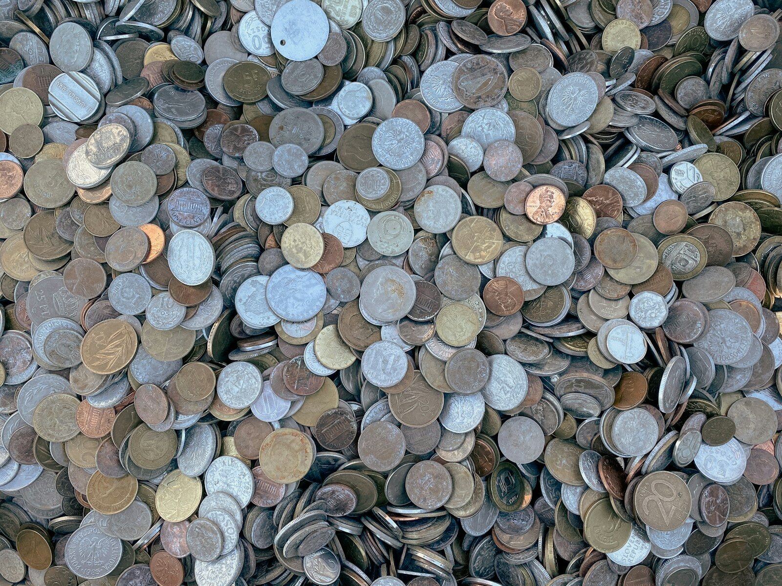 Photo by rc.xyz NFT gallery a pile of different types of coins
