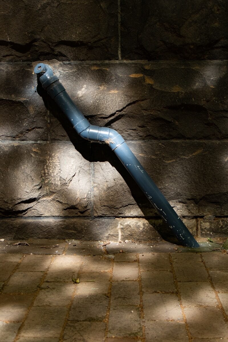 Photo by Mitchell Luo blue plastic pipe