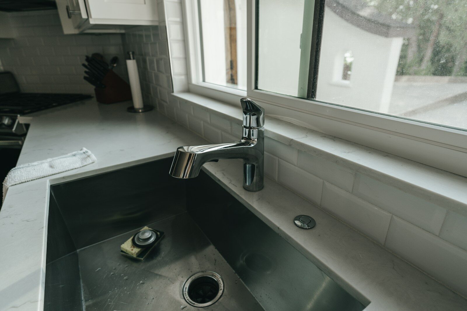 Photo by Henry Kobutra a sink with a faucet
