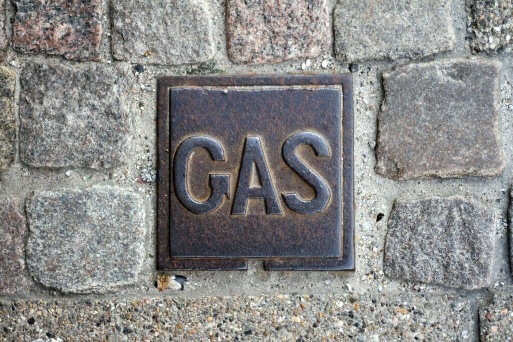 a sign on a stone wall